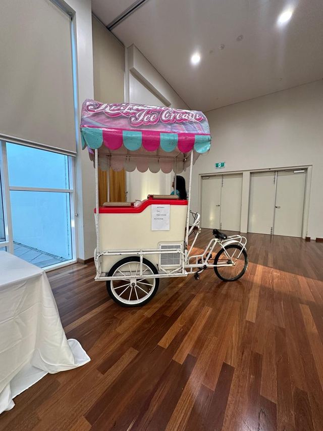 Vintage ice cream bicycle cart with scalloped pink awning at an Urban Pop Ups Perth pop-up market