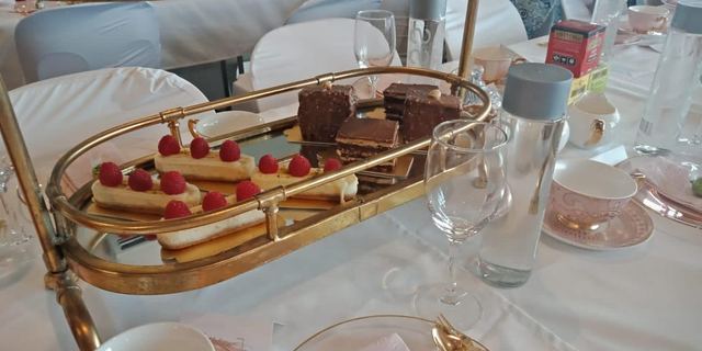 Raspberry dessert plated on a gold-trimmed tray at an elegant Urban Pop Ups dinner event