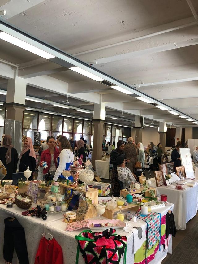 Vendor stalls in a bright market hall at an Urban Pop Ups event in Perth