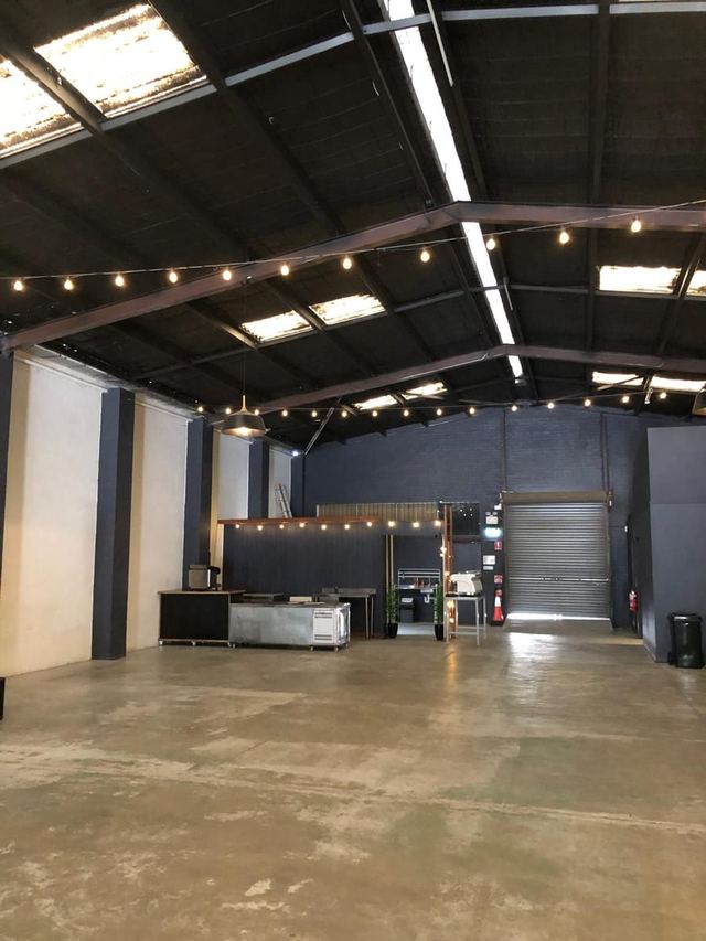 Warehouse venue strung with fairy lights ahead of an Urban Pop Ups pop-up event